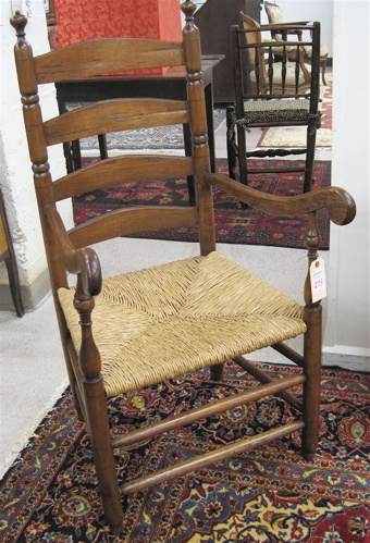 Appraisal: SLAT-BACK ARMCHAIR American th century the back featuring four shaped