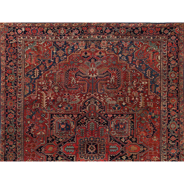 Appraisal: Heriz rug c stylized floral design on a red field