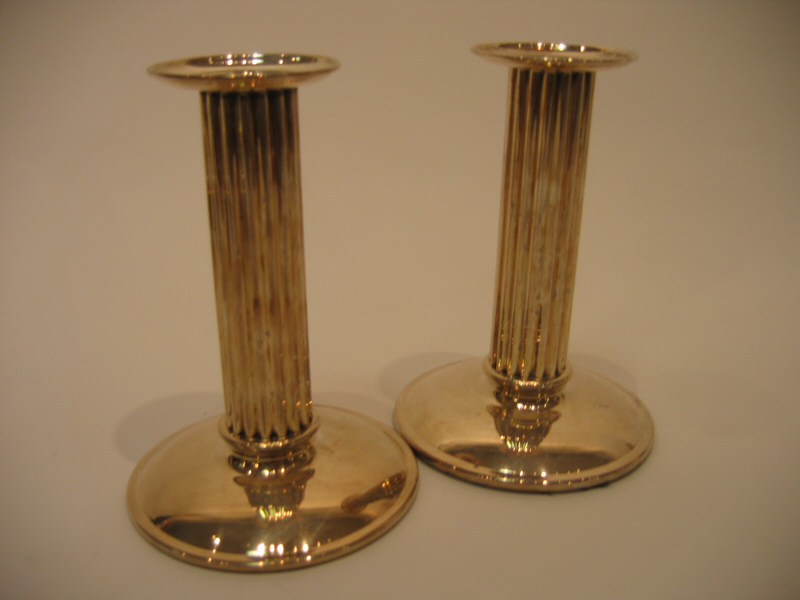 Appraisal: KRONEN DENMARK Pair silver columnar candlesticks with fluted shafts signed