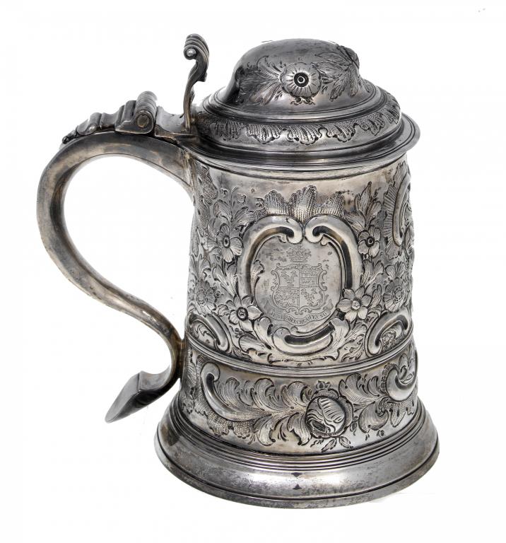 Appraisal: A GEORGE II TANKARD with scroll thumbpiece later chased with