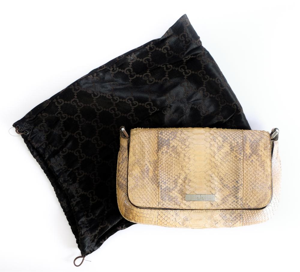 Appraisal: GUCCI PYTHON CLUTCH PURSEIridescent Gucci python skin clutch purse with