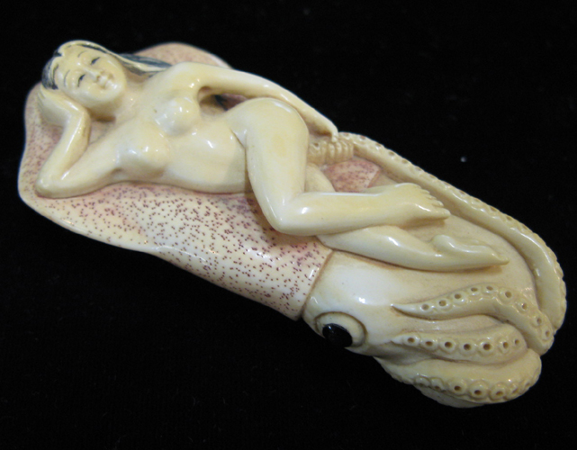 Appraisal: EROTICA A JAPANESE IVORY CARVED NETSUKE in the form of