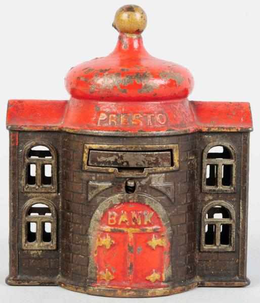 Appraisal: Cast Iron Presto Mechanical Bank Working Includes original key Condition