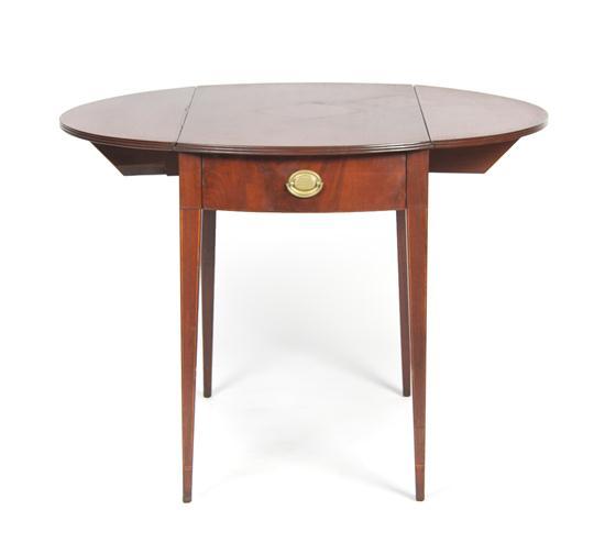 Appraisal: An American Mahogany Drop-Leaf Table having a rectangular top with