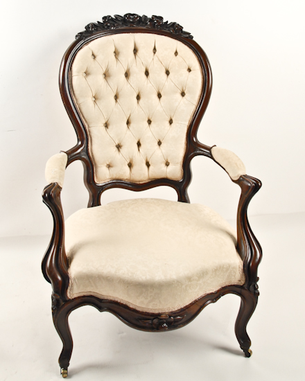 Appraisal: A Rococo Revival Gentleman's Chair of walnut with carved crest