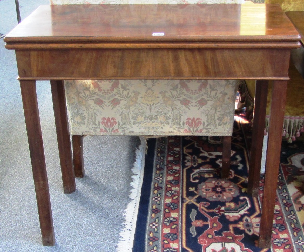 Appraisal: A mid th century rectangular mahogany card table on square