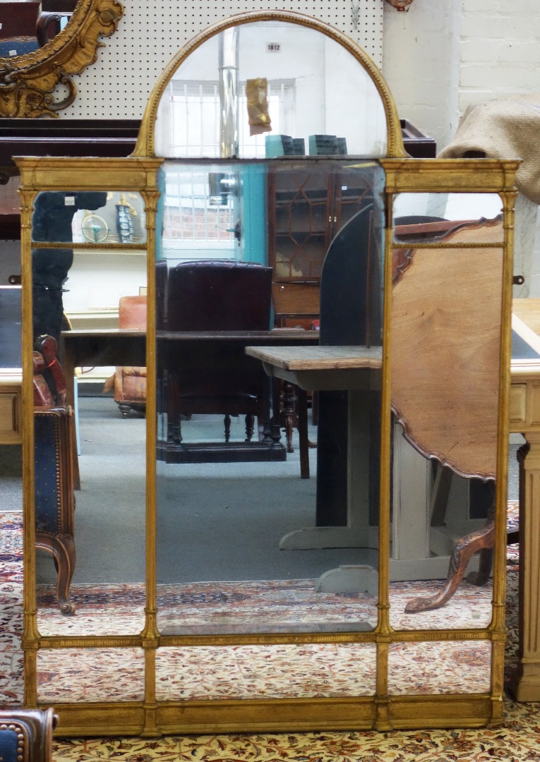 Appraisal: An early th century gilt framed arch top wall mirror