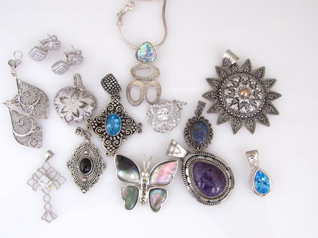 Appraisal: A group of sterling silver fashion jewelry including pendants one