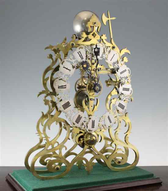 Appraisal: A large Victorian single fusee brass skeleton clock with pierced