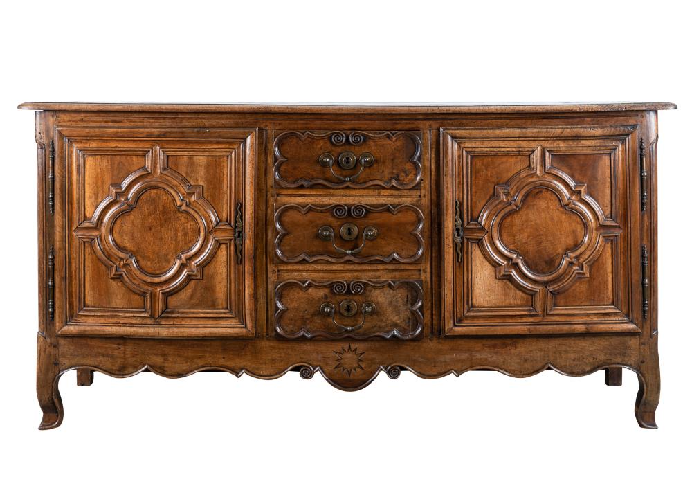 Appraisal: FRENCH PROVINCIAL WALNUT BUFFETthe rectangular top over a pair of