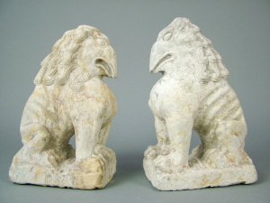 Appraisal: A pair of Chinese carved stone bird headed seated lions