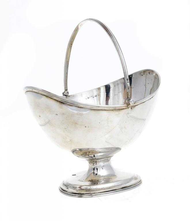 Appraisal: A VICTORIAN SUGAR BASKET of plain oval shape with reeded