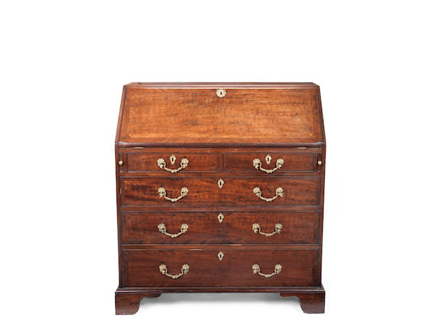 Appraisal: A George III mahogany bureau the fall enclosing six drawers