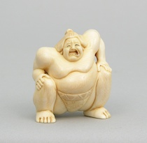 Appraisal: A Carved Japanese Okimono of a Sumo Wrestler Carved ivory