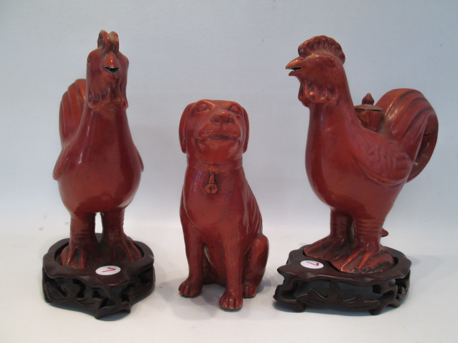 Appraisal: THREE CHINESE POTTERY ANIMALS with all over red glaze two