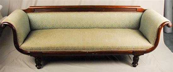 Appraisal: A Baltimore Sheraton Empire Sofa with a fluted crest scrolled