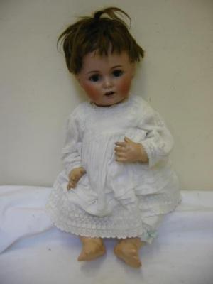 Appraisal: A Kestner bisque head doll with blue lashed sleeping eyes