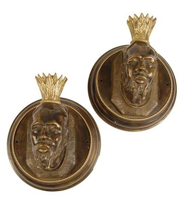 Appraisal: A pair of bronzed wall lights modelled as a bearded