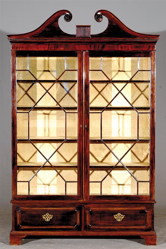 Appraisal: English Chippendale style mahogany bookcase mid th century broken-arch top