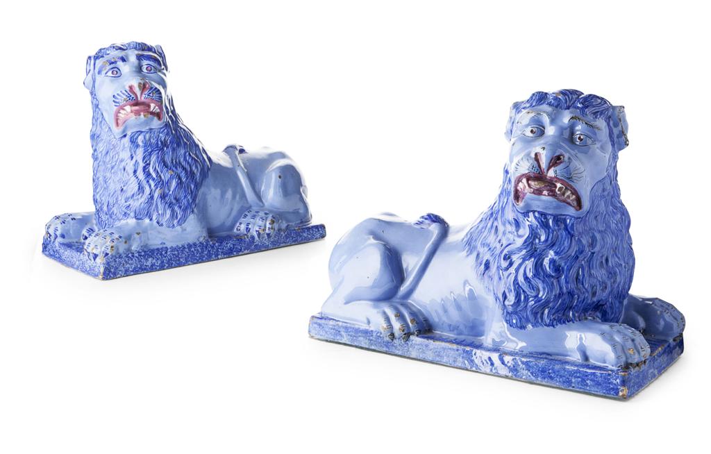 Appraisal: PAIR OF LARGE FRENCH FAIENCE FIGURES OF RECUMBENT LIONS LATE