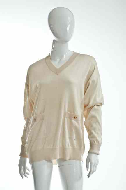 Appraisal: CHANEL BOUTIQUE IVORY SWEATER late s size retailed Bergdorf Goodman