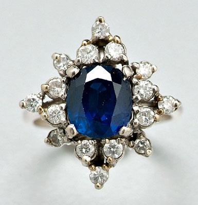 Appraisal: Sapphire and diamond ring one oval faceted medium to intense