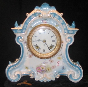 Appraisal: AN ANSONIA CHINA PORCELAIN CLOCK time and strike floral decorated