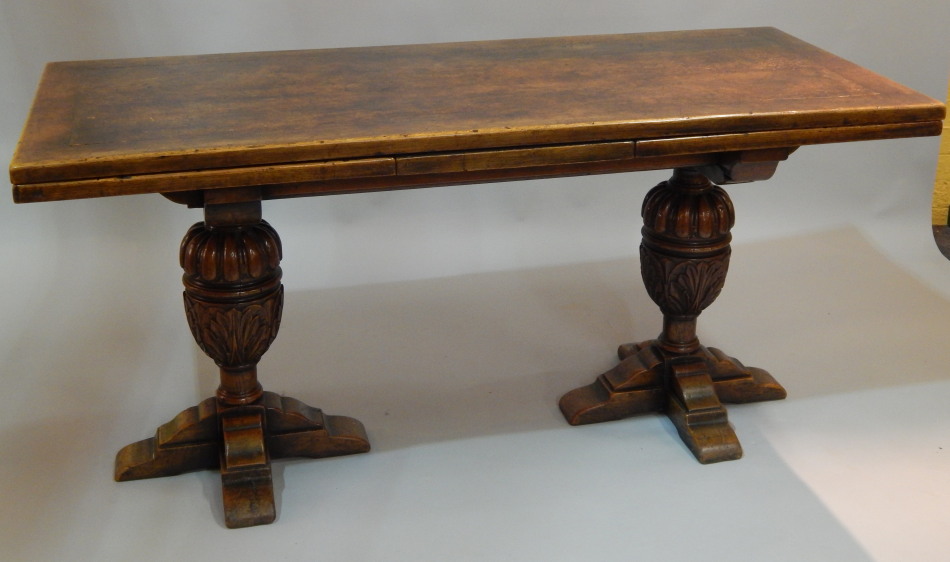 Appraisal: An oak drawleaf refectory type table on cup and cover