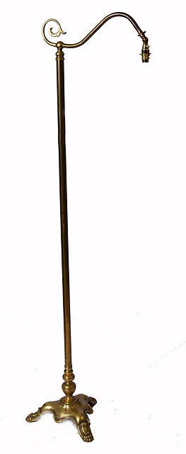 Appraisal: A BRASS READING LAMP with scroll bracket central column and