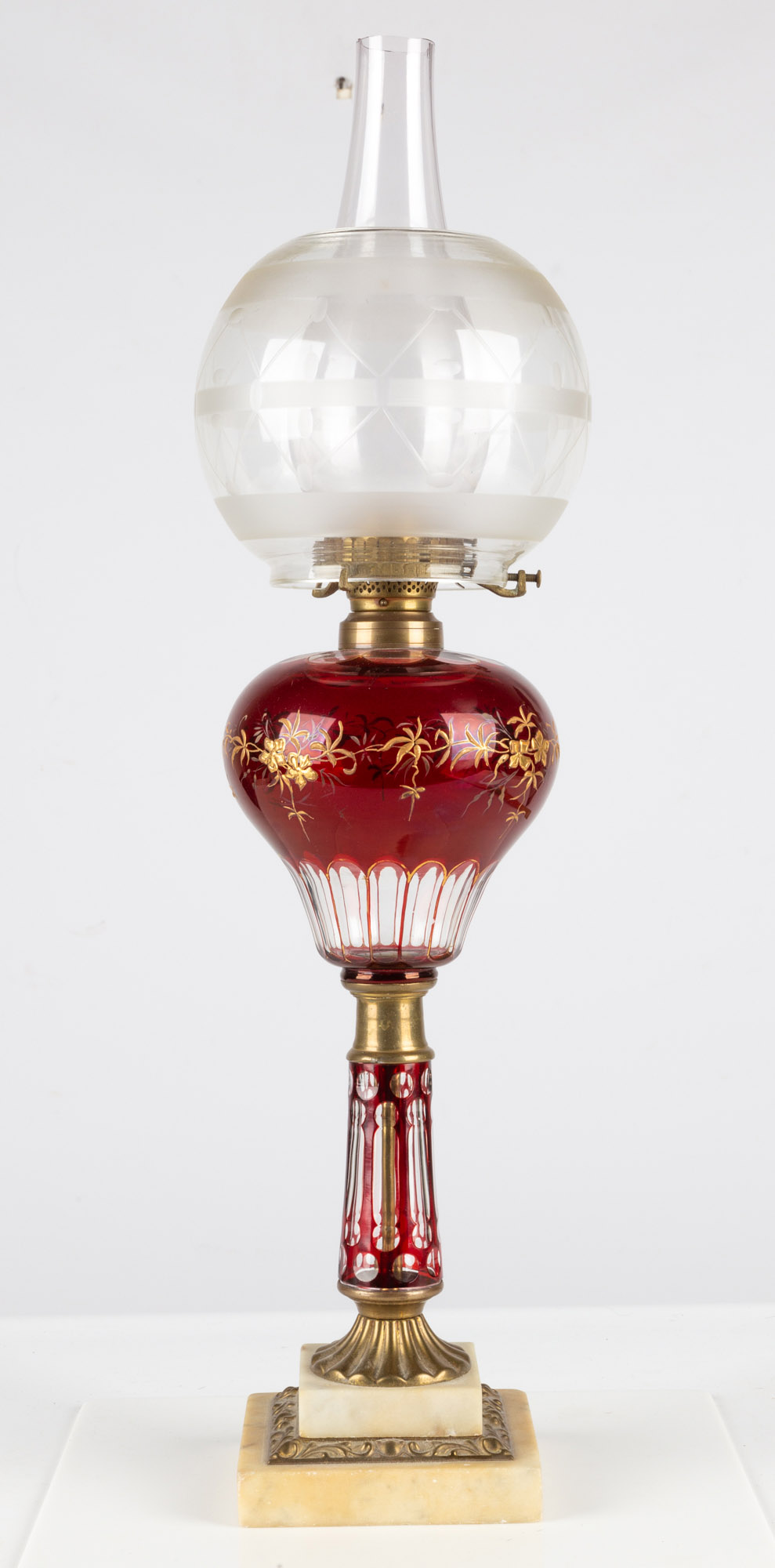 Appraisal: CRANBERRY CUT AND STAINED OIL LAMP circa Cranberry stained shade