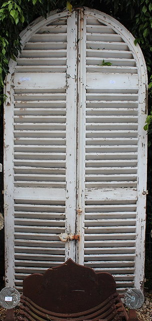 Appraisal: A PAIR OF WHITE PAINTED ARCHING SHUTTERS cm wide X