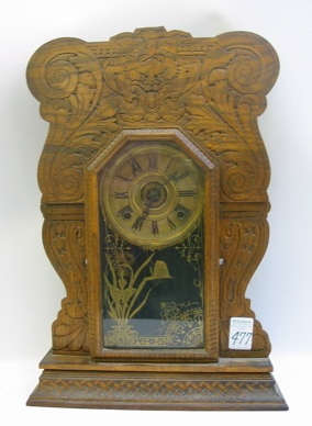 Appraisal: AN AMERICAN OAK CASED KITCHEN CLOCK time and strike with