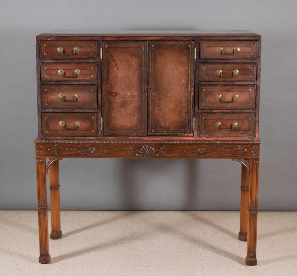 Appraisal: GEORGIAN STYLE CHEST ON STAND and eight drawer two door