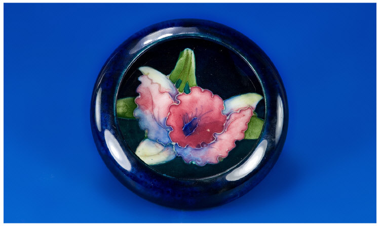 Appraisal: Moorcroft Small Lipped Bowl Orchid design on Royal blue ground