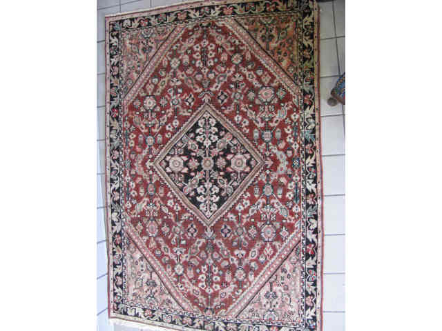 Appraisal: Mahal Persian Handmade Rug stylized floral on salmon field '