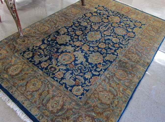 Appraisal: HAND KNOTTED ORIENTAL CARPET Indo-Persian overall floral design on dark