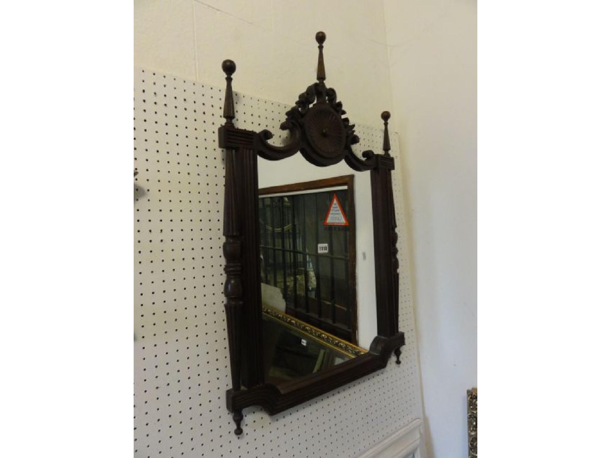 Appraisal: A wall mirror the carved and reeded frame with shaped