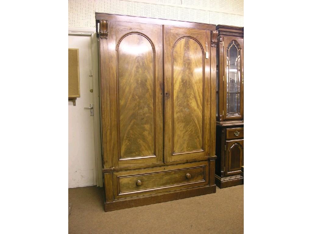 Appraisal: A Victorian mahogany wardrobe pair of arched panel doors enclosing