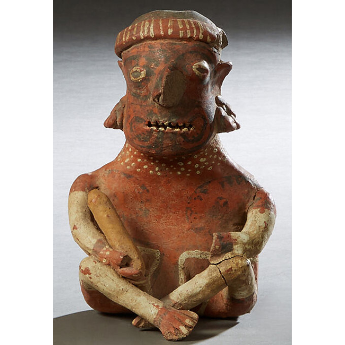 Appraisal: Pre-Columbian Pottery Figure of a cross legged seated man with