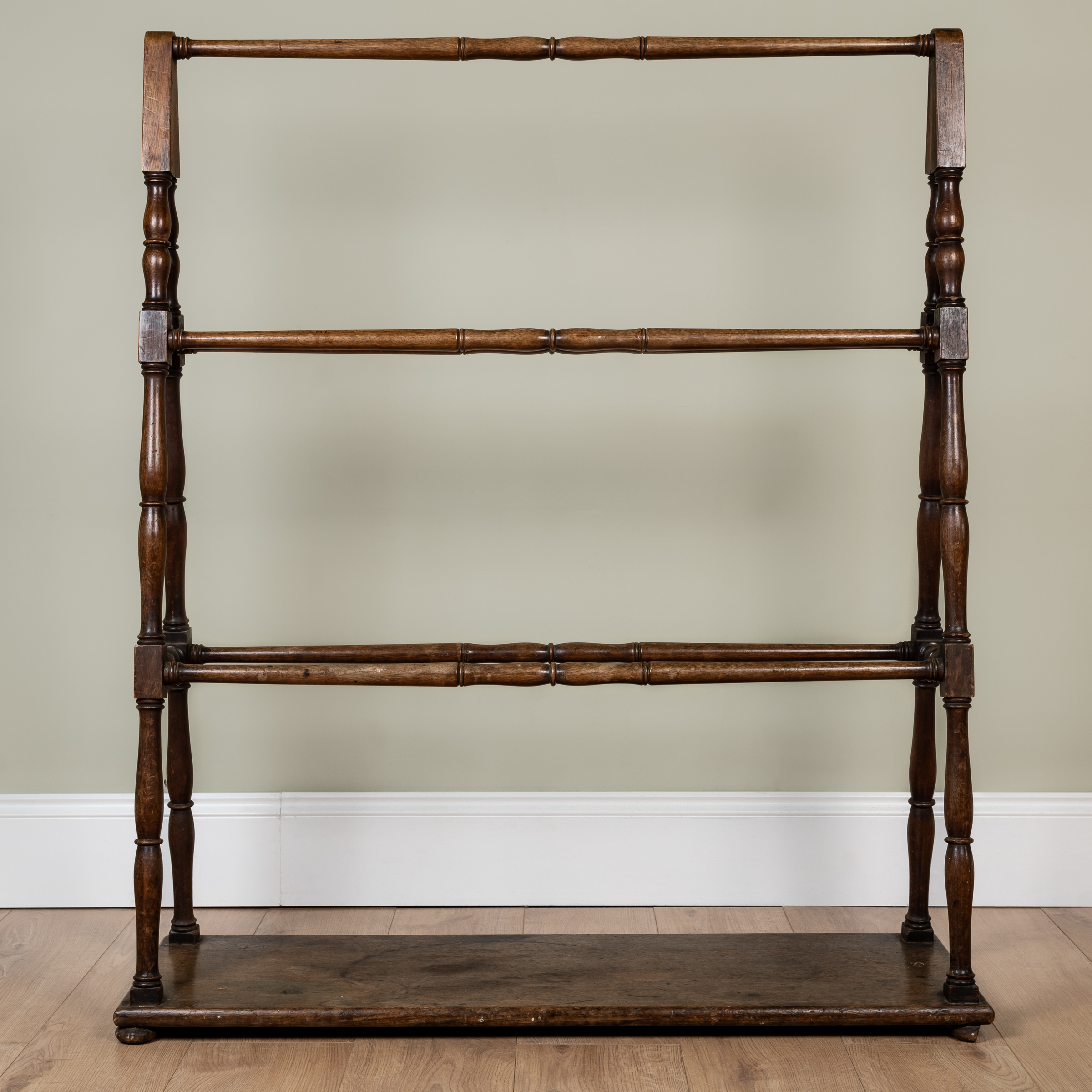 Appraisal: A th century mahogany country house towel rail with triangular