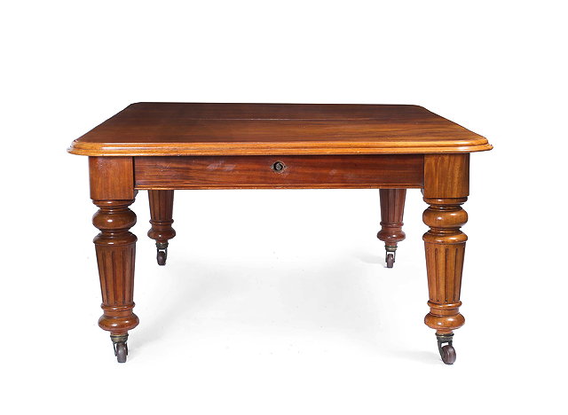 Appraisal: A VICTORIAN MAHOGANY WIND OUT EXTENDING DINING TABLE with turned