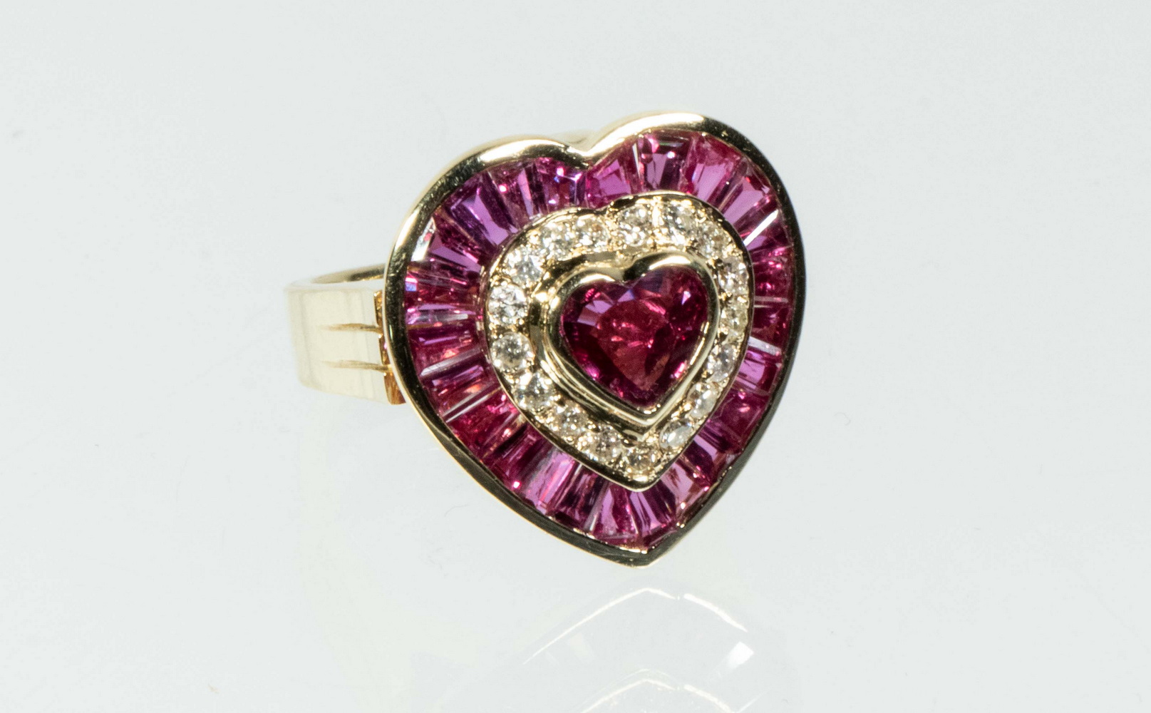 Appraisal: LADIES K GOLD RUBY AND DIAMOND RING Heart shaped setting