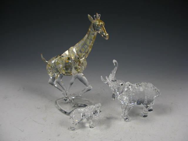 Appraisal: Three Swarovski Animals giraffe with broken tail in two elephants