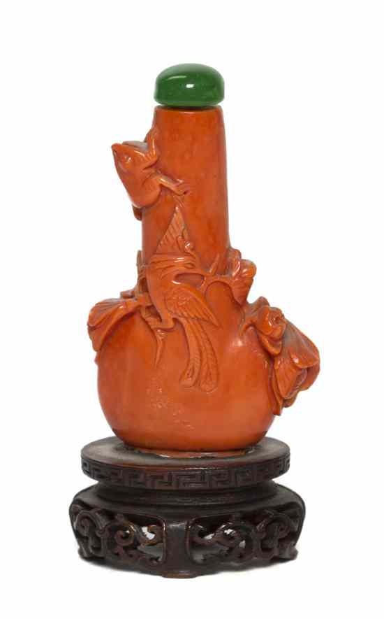 Appraisal: A Carved Coral Bottle-Form Snuff Bottle having carved decoration of