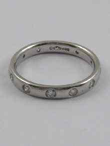 Appraisal: A white metal tests ct gold diamond eternity ring size