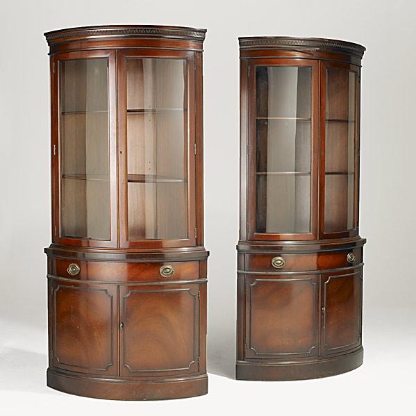 Appraisal: PAIR OF BOWFRONT CORNER CABINETSMahogany th c Travis Court by