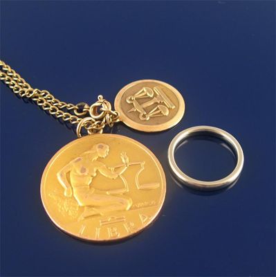 Appraisal: Two ct gold 'Libra' pendants on a ct gold chain