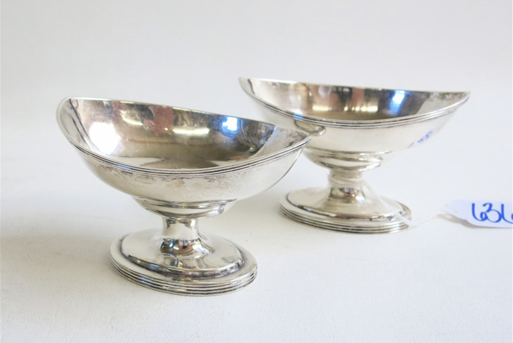 Appraisal: TWO ENGLISH STERLING SILVER FOOTED MASTER SALTS hallmarked British sterling