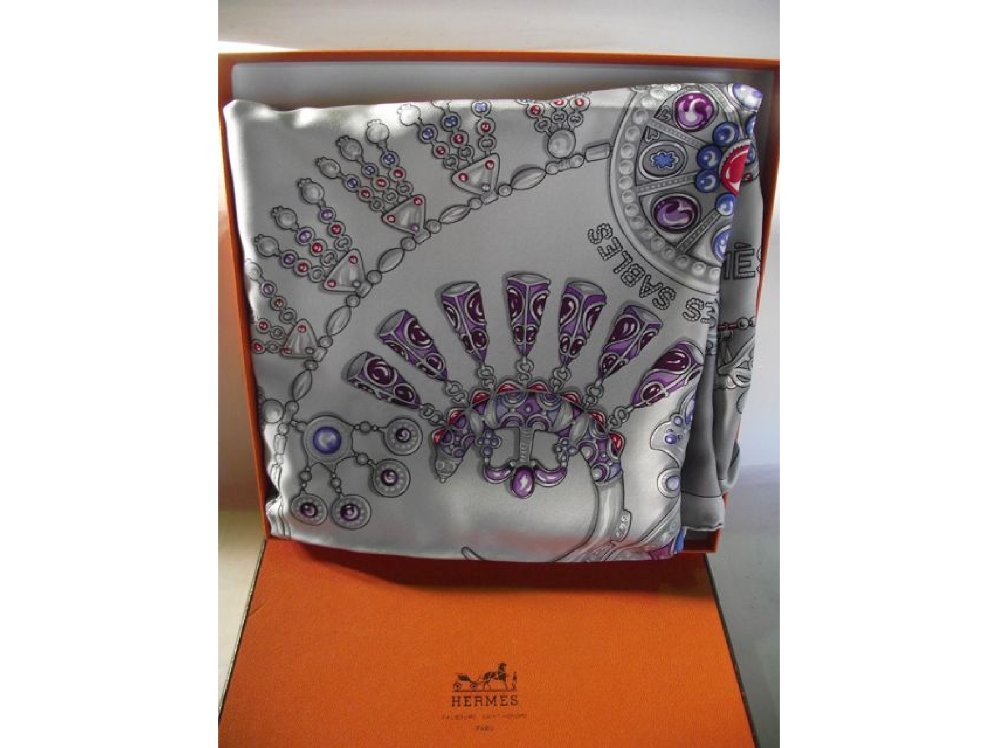 Appraisal: A boxed silk scarf by Hermes Paris - Parures Des