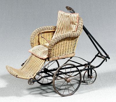 Appraisal: Wicker pull type doll carriage seat with springs foot rest